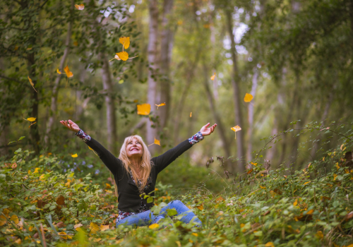 person playing with leaves